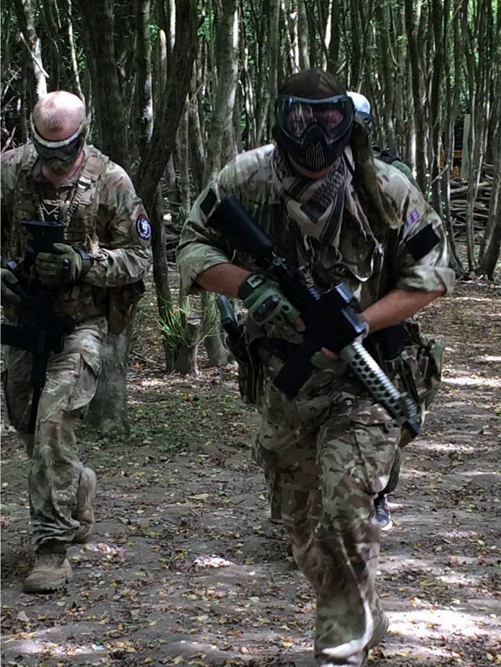 Two players advancing through the trees during a session